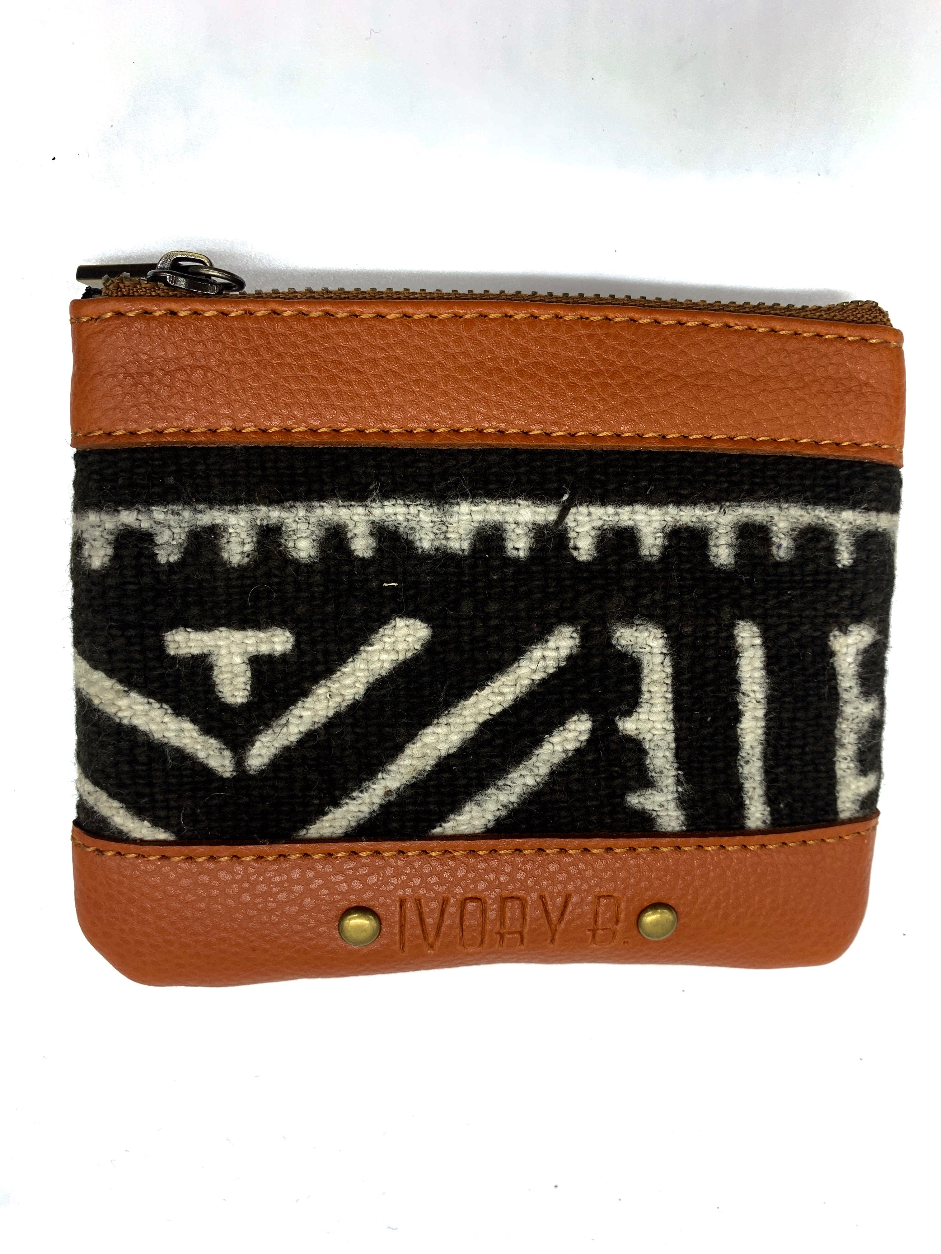 Ivory. B front: The Fitini Pouch Brown saw